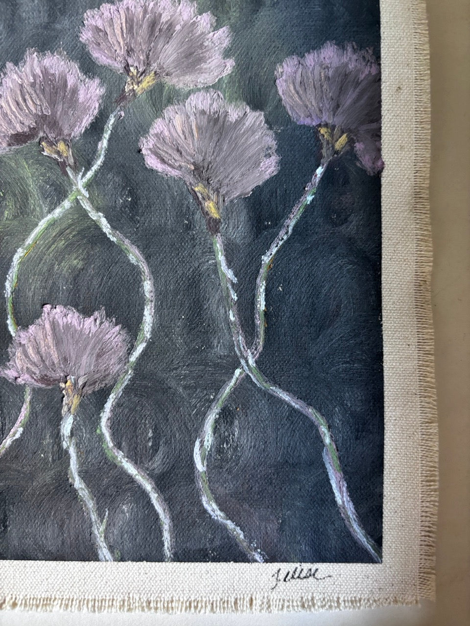 A close-up of a textured painting depicting lavender-purple flowers with wavy stems on a dark, textured background, finished with a visible canvas edge and signature.